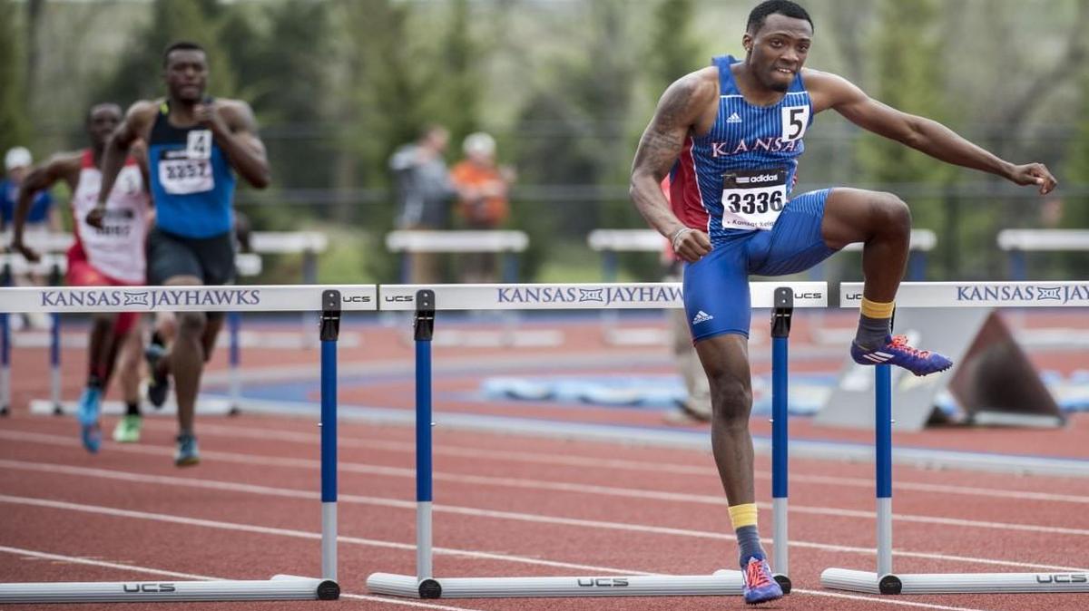 Michael Stigler (right) cleared the last hurdle in the last heat of the 400-meter hurdles during the Kansas Relays at Rock Chalk Park last year in Lawrence.